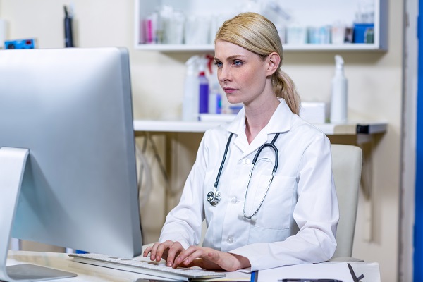 A woman vet working with her computer at medical office